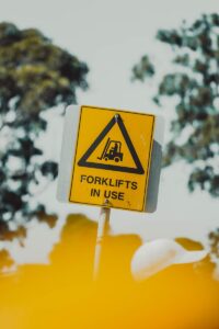 a yellow sign on a pole